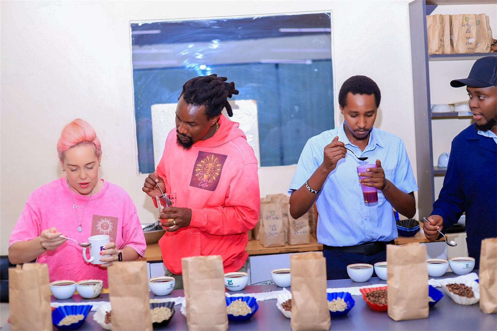 Coffee samples on the cupping table with professional graders in Kenya