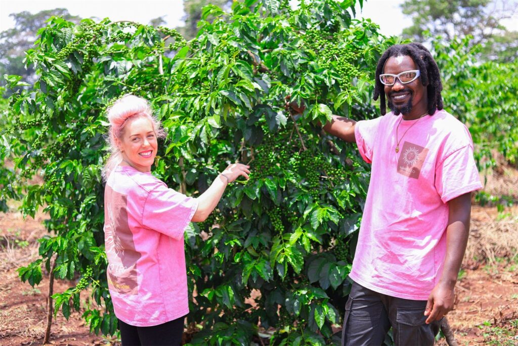 Mambo Leo founders inspecting a coffee tree in Central Kenya