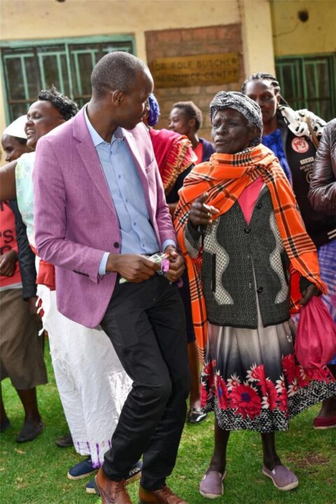 A handshake between community members in Kenya